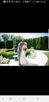 Bride and groom in wedding garden.