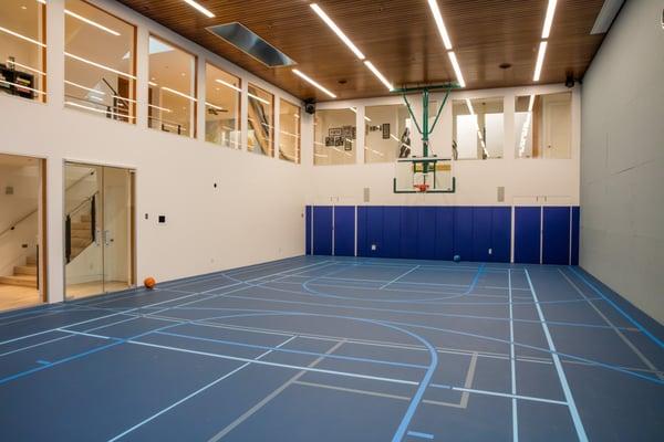 Sports court with Paradigm speakers and projection system