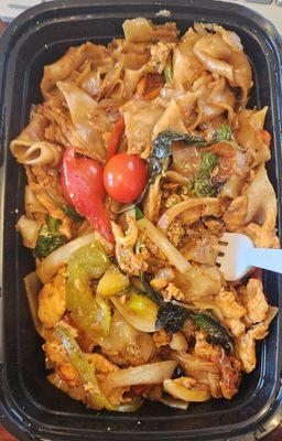 Pad Kee Mao with chicken and medium spicy. Bell peppers and onions galore mixed with the Thai basi and tomato is delicious