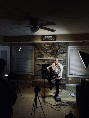 Client and musician Jay Hill is filmed for his music video compilation to pitch to local gig opportunities.