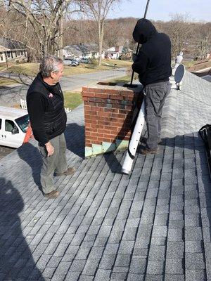 Owner and our team as we sweep and inspect a chimney from the roofline!