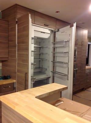 This picture is of custom panels using Ikea product on high end refrigerator. Custom size cabinets above