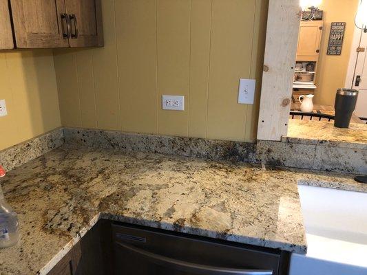 The backsplash and riser needed to be fit, cot and polished. The riser had to be cut to accept the electrical receptacle.