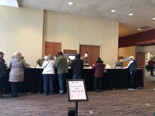 Efficient National Guard registration station.  Questionnaire and shots conducted in another massive room with maybe 200 Guardsmen.