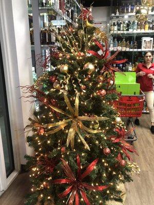 Christmas tree by the door.