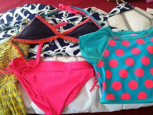 A bikini, a rash guard and two dresses for $50. Total.