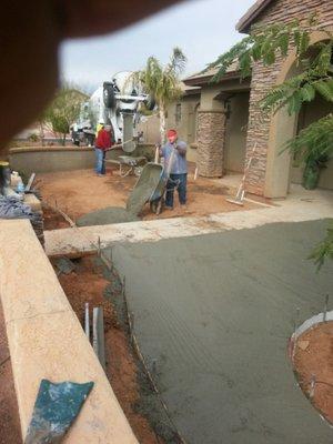 Concrete pour. From dirt work to installation.  We do it all