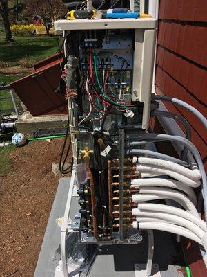 Heat pump condenser unit being hooked up