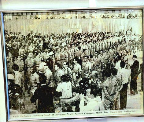 Mr. Santiago is facing left in the bottom left corner of this picture of captured heroes from the Bay Of Pigs invasion.