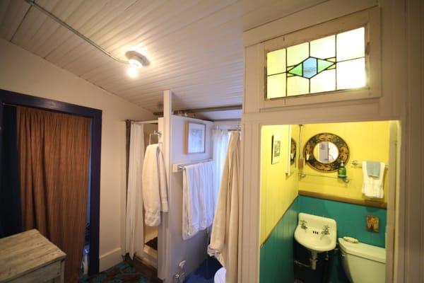 The bathroom with shower and separate toilet