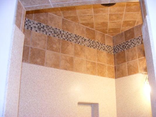 Add tile over your tubs and showers to beautify and protect your walls