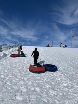 Must walk your tubes back up the hill yourself