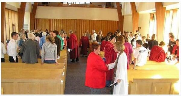 Greeting each other during a church service.