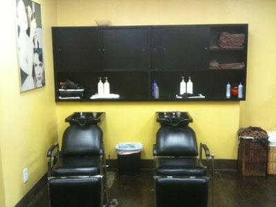 Chairs to wash hair at His n' Hers Cuts located in Downey, California.