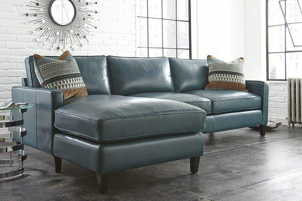 The St. Croix is our #1 selling sofa sectional! It's covered in a gorgeous 100% teal color leather accented with two pillows.