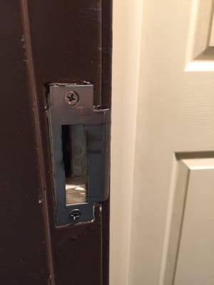 Broken door to Suite 215