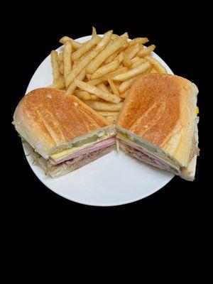 Cuban Sandwich, Our classic pressed sandiwch made with our delicious shredded pork, ham, Swiss cheese, pickles and mustard with fries