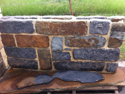 Blue & rust stone wall, buff mortar