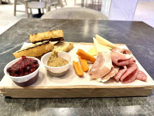 Cheese and charcuterie. Normally also includes pickled veggies and apple slices.