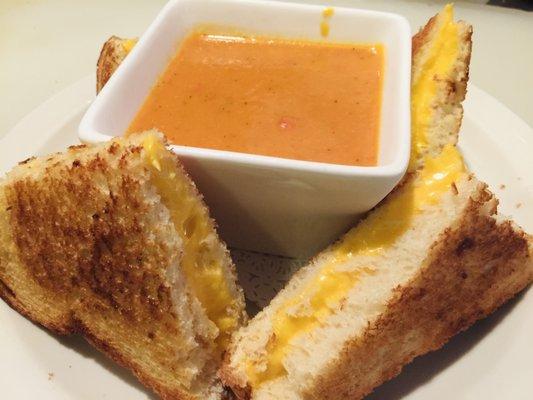 Grilled cheese with a cup of soup.