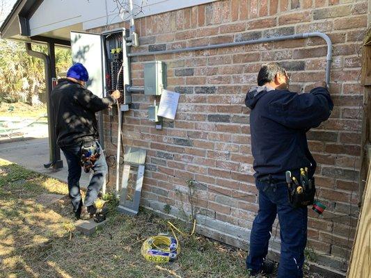 Installing electric panel and emergency transfer switch for the generator.