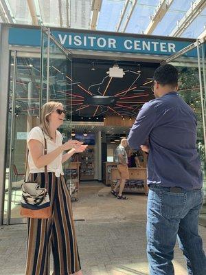 Visitors outside the Visitor Center in Director Park