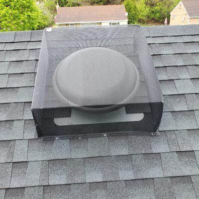 Protective cover over attic power fan