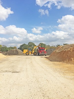 We haul the material to you! Our 12 yard, tandem dump trucks deliver aggregate and dirt directly to your home.