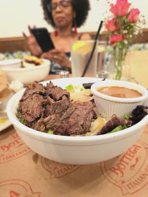 Bistecca E Zola Salad Roasted Angus steak, mixed greens, cherry tomatoes, Gaeta olives, sautéed onions, gorgonzola, balsamic dressing.