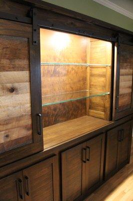 Large poplar china cabinet with sliding upper doors.