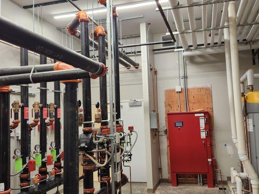 Water risers and control box for the fire sprinkler system and pump.