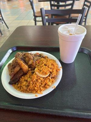 Shredded beef, plaintains, and yellow rice with mango drink