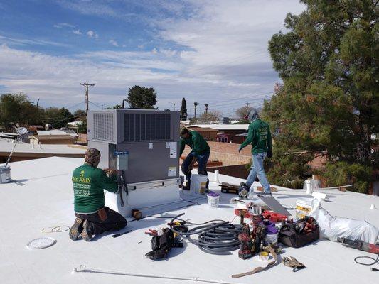 Installing a Carrier high efficiency air conditioning and heating system in central Tucson.