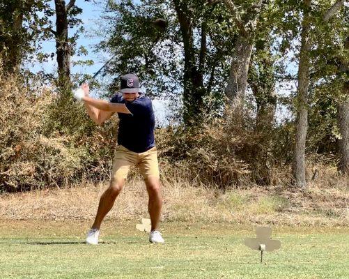 Alex Cronin teeing off at Texas Rangers in the Two Man Challenge.