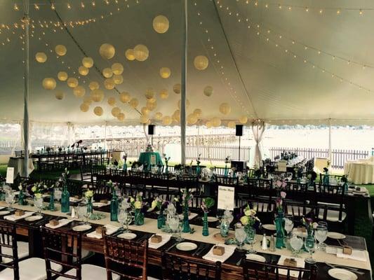 Farm Tables, Paper Lanterns Clustered Over Dance Floor, Bistro Lights, and Chiavari Chairs