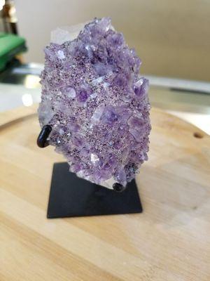 Amethyst crystals growing on calcite.