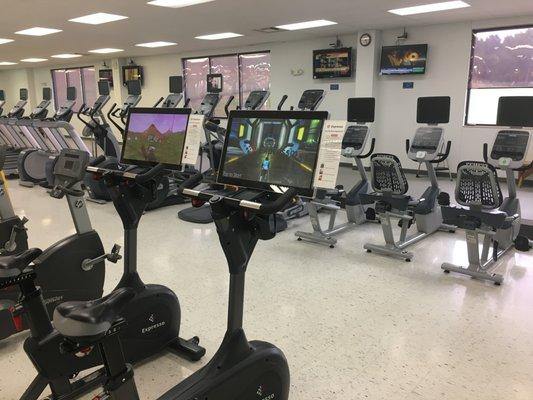 Cardio floor with treadmills, stepmill, row machine, ellipticals, bikes, Nustep.