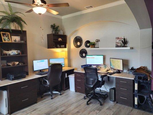 New office space with built in desks and shelves.