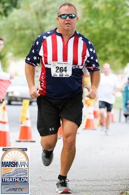 Ken competes in the Marsh Man Sprint Triathlon.