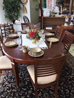 Beautiful table and chairs. Oh my! Looks like they have never been used.