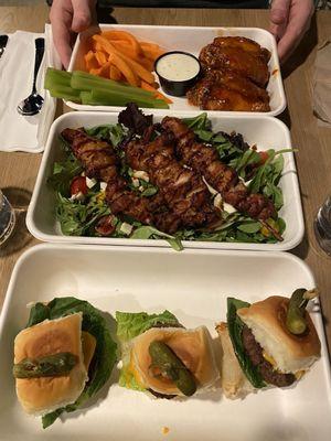 Sliders, chicken skewer, wings