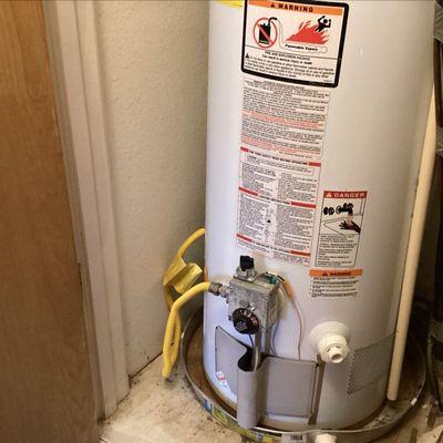 Gas Water heater missing drip tube/sediment catcher.