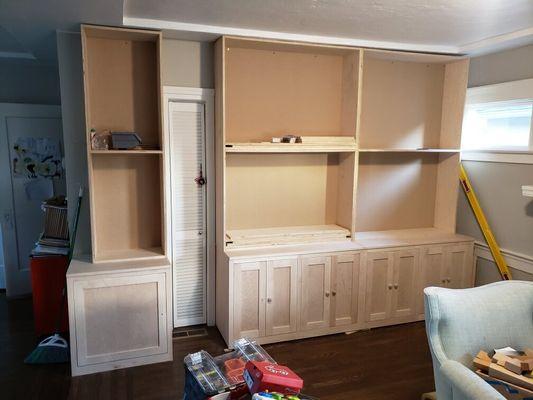 Custom cabinets and shelving in progress.