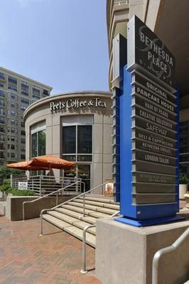 Outside shot of building courtyard, with steps lead across to the Bethesda  Metro Station