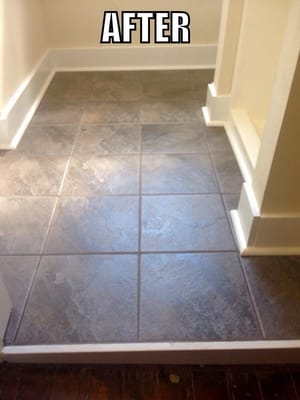 I sloped the floor a small amount away from shower put down tile with new trim.