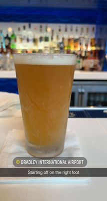 Enjoying a cold one before our flight.