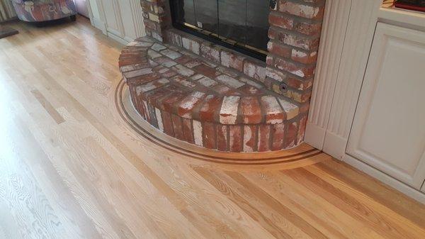 Red Oak plank floor with a curved 'bent' border & feature strip!