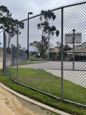 Basketball court at entrance from parking lot.