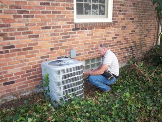 Inspecting A/C unit.