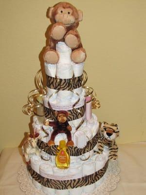 Tiger print animal theme Diaper Cake with monkey topper and finger puppets